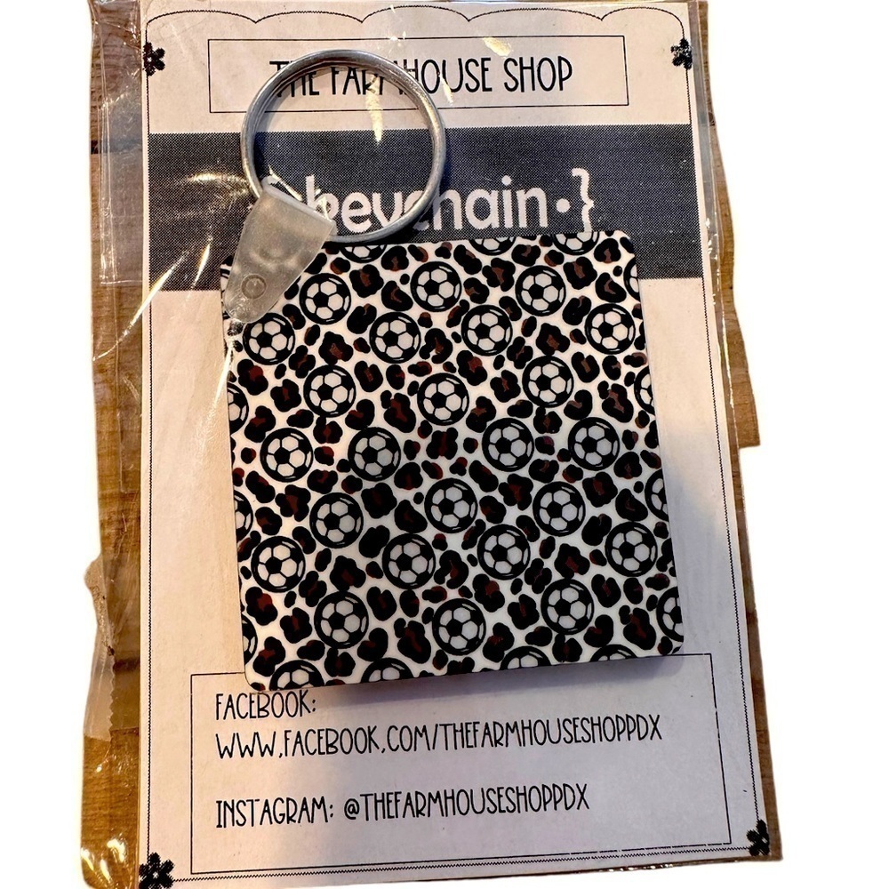 Locally made Soccer Ball/animal print keychain, double sided design.